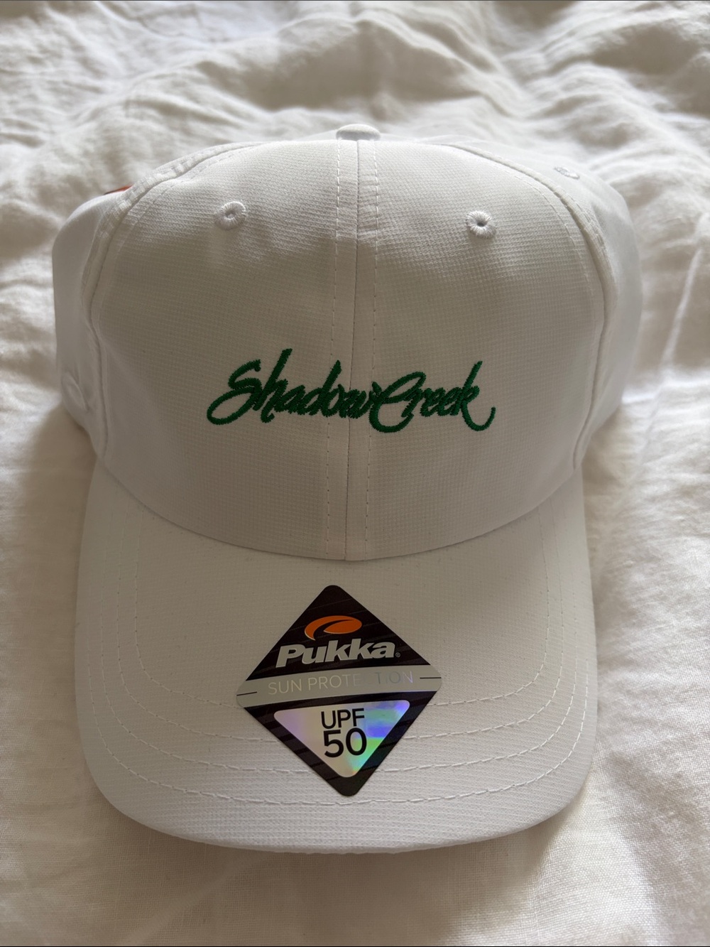 Shadow Creek Golf Club White Cap with Green Embroidery